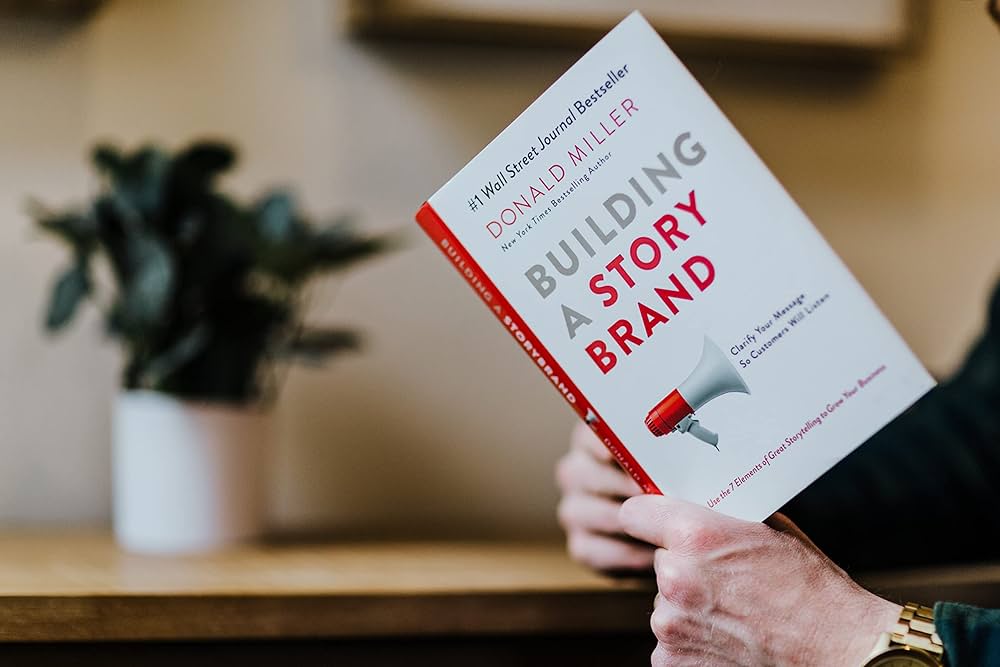 Someone holding Building a StoryBrand by Donald Miller