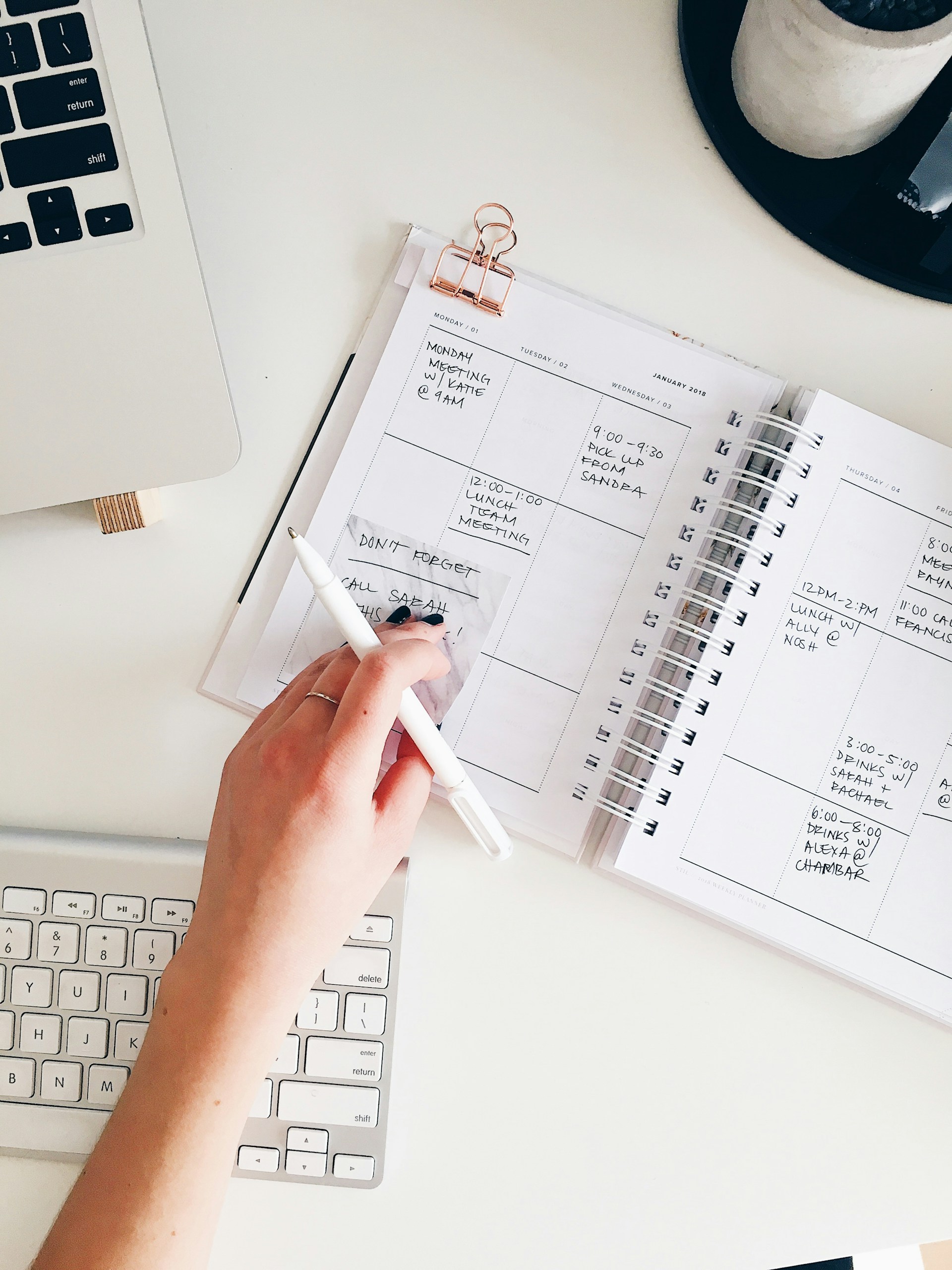 A closeup of a busy small business owner's agenda sitting on a desk