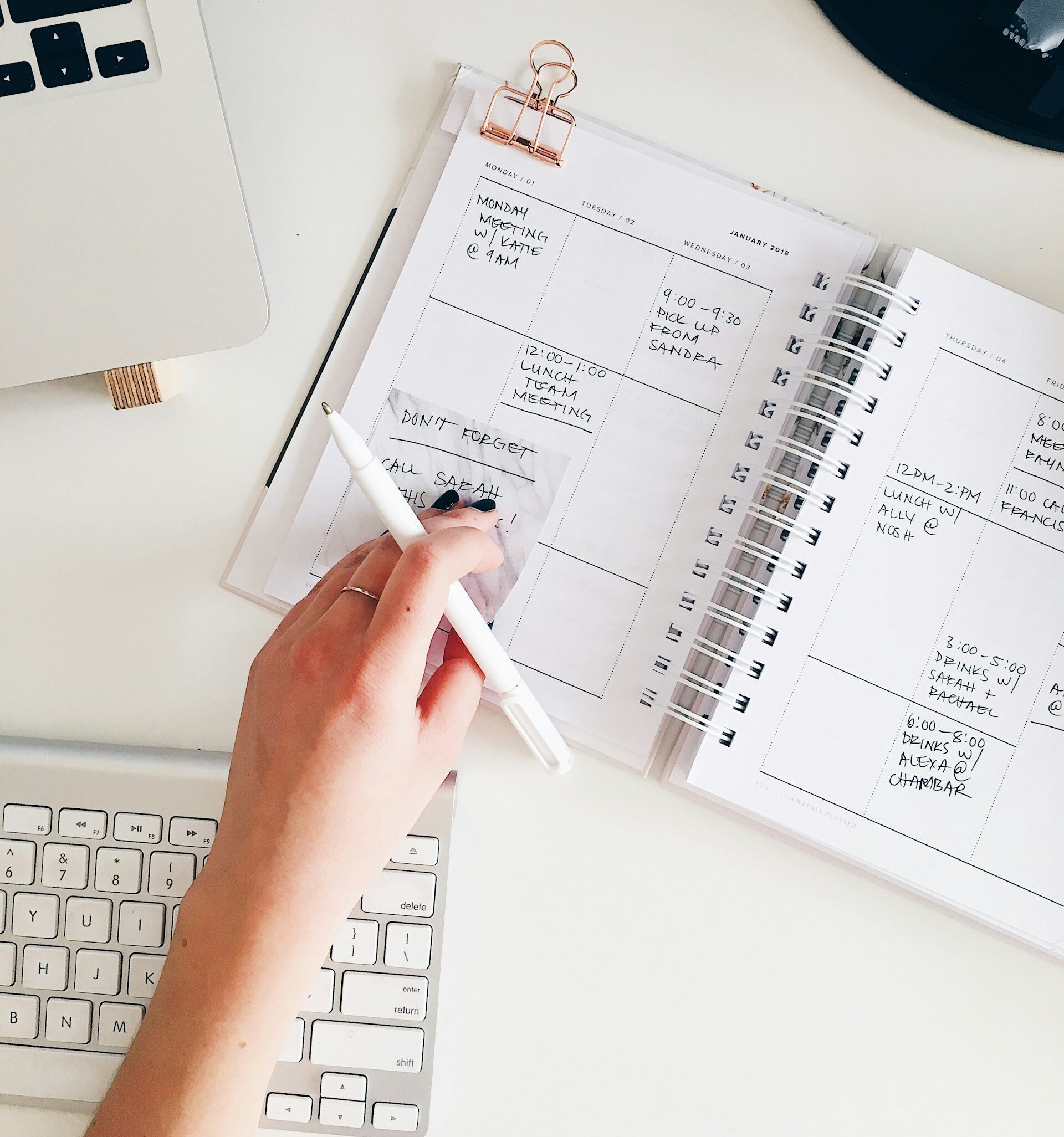 A closeup of a busy small business owner's agenda sitting on a desk