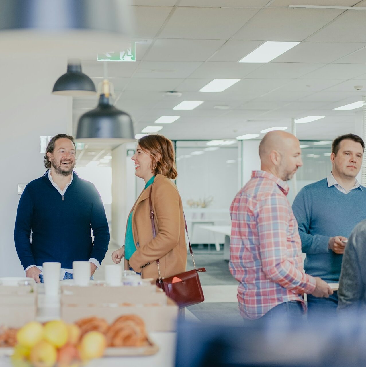A group of people talking at a networking event