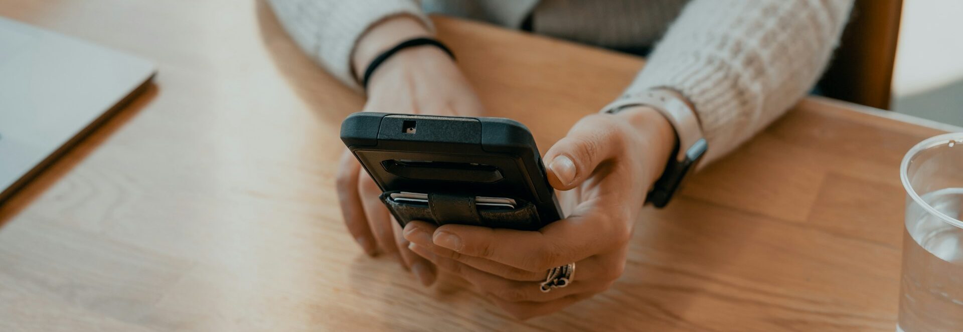 Overhead shot of a business owner texting their business coach for help